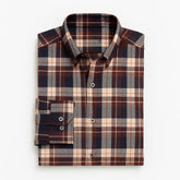 Camisa masculina flanelada xadrez  manga longa, 100% algodão, bolso frontal e gola com botão, estilo casual elegante.