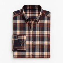 Camisa masculina flanelada xadrez  manga longa, 100% algodão, bolso frontal e gola com botão, estilo casual elegante.