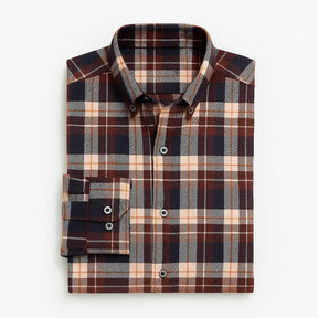 Camisa masculina flanelada xadrez  manga longa, 100% algodão, bolso frontal e gola com botão, estilo casual elegante.