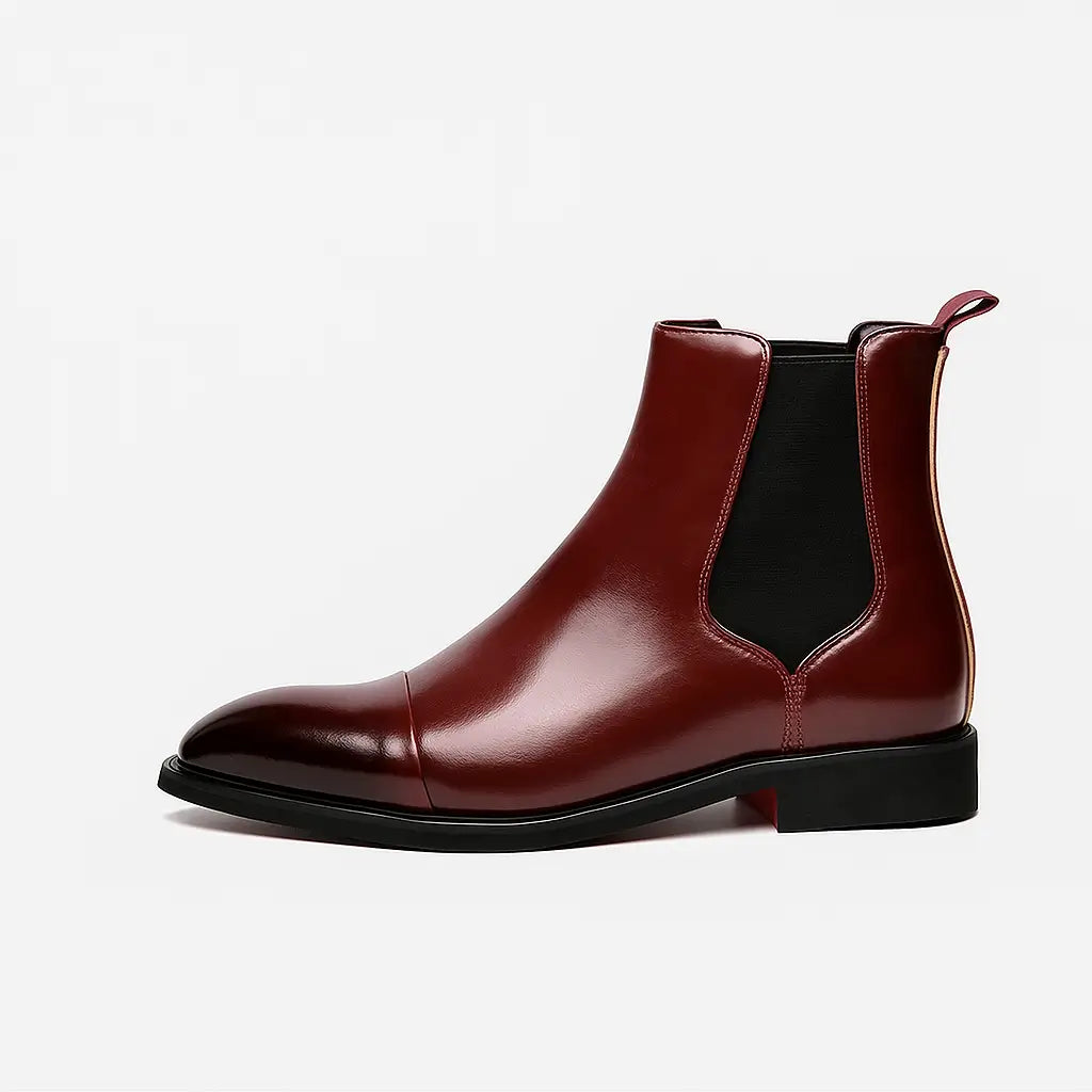 Bota Chelsea masculina preta com sola vermelha em couro premium, vista lateral e detalhe da sola