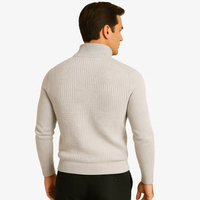 Homem elegante vestindo suéter cinza com zíper e textura geométrica. Estilo casual sofisticado para o outono e inverno.